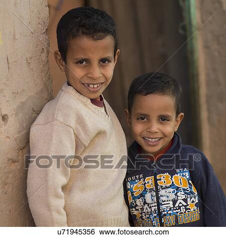 Portrait of two boys smiling, Ouarzazate, Souss-Massa-Draa, Morocco View Large Photo Image Stock Photograph - Portrait of two boys smiling, Ouarzazate, Souss-Massa-Draa, Morocco. Fotosearch