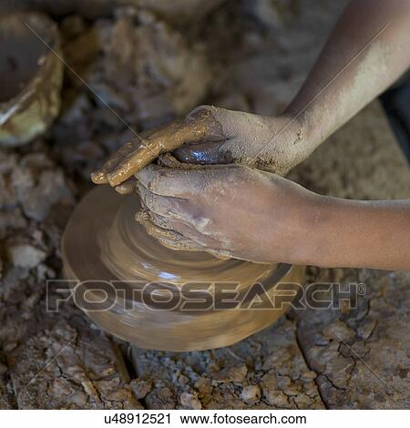 Stock Image - Potter at work, Morocco. Fotosearch