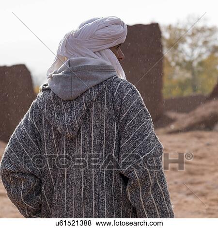 Rear view of a Tuareg man standing, Telouet, Ouarzazate, Souss-Massa-Draa, Morocco View Large Photo Image Stock Photo - Rear view of a Tuareg man standing, Telouet, Ouarzazate, Souss-Massa-Draa, Morocco. Fotosearch