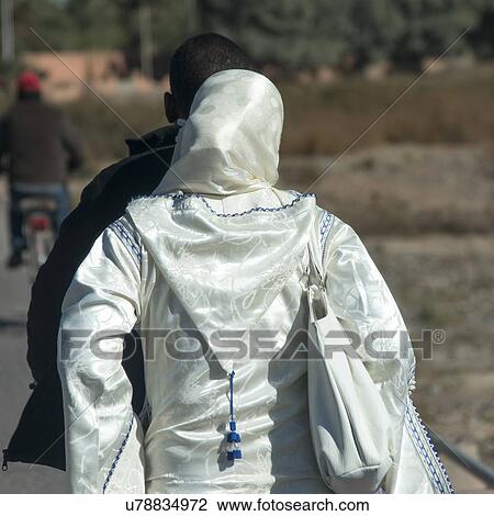 Rear view of a woman in traditional dress, Ouarzazate, Morocco View Large Photo Image Stock Image - Rear view of a woman in traditional dress, Ouarzazate, Morocco. Fotosearch