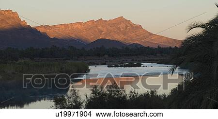 Picture - River with mountains at sunset, Atlas Mountains, Morocco. Fotosearch