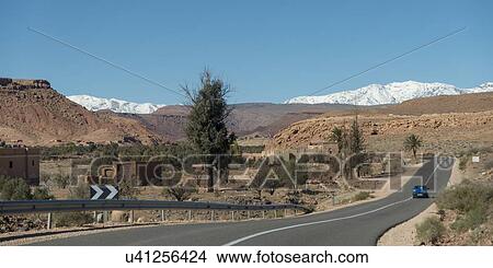 Picture - Road leading towards snowcapped mountains, Atlas Mountains, Morocco. Fotosearch
