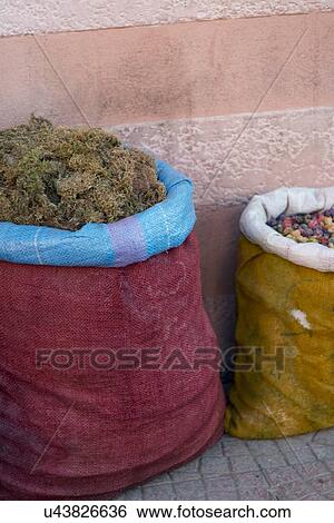 Stock Photograph - Sacks of food for sale at market stall, Medina, Marrakesh, Morocco. Fotosearch
