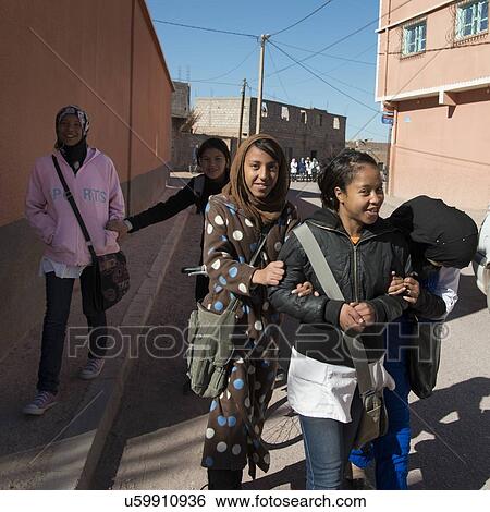 Schoolgirls enjoying on the street, Ouarzazate, Souss-Massa-Draa, Morocco View Large Photo Image Stock Photograph - Schoolgirls enjoying on the street, Ouarzazate, Souss-Massa-Draa, Morocco. Fotosearch