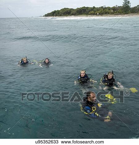 Scuba divers in the sea, Utila, Bay Islands, Honduras View Large Photo Image Stock Image - Scuba divers in the sea, Utila, Bay Islands, Honduras. Fotosearch