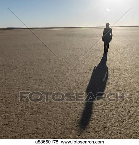 Shadow of a woman on Erg Chegaga Dunes in Sahara Desert, Guelmim-Es Semara, Morocco View Large Photo Image Stock Photography - Shadow of a woman on Erg Chegaga Dunes in Sahara Desert, Guelmim-Es Semara, Morocco. Fotosearch