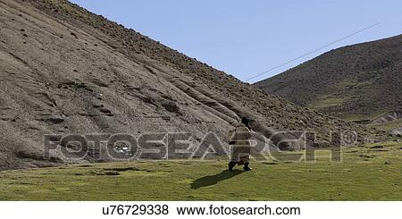Shepherd in a valley, Atlas Mountains, Morocco View Large Photo Image Stock Photo - Shepherd in a valley, Atlas Mountains, Morocco. Fotosearch