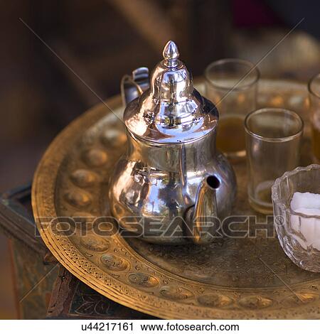 Stock Image - Silver teapot with glasses on a tray, Ouarzazate, Morocco. Fotosearch