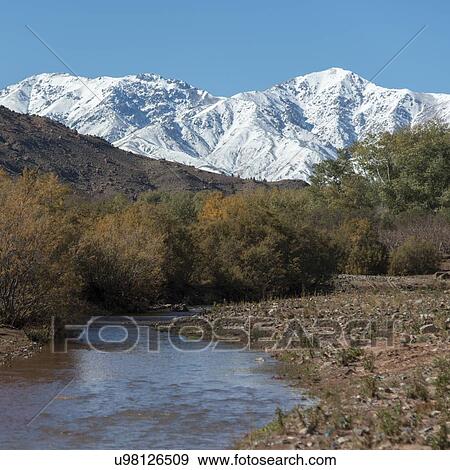Stream flowing through snowcapped mountains, Atlas Mountains, Morocco View Large Photo Image Stock Photo - Stream flowing through snowcapped mountains, Atlas Mountains, Morocco. Fotosearch
