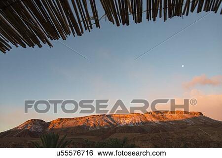 Sunlight on mountains at dusk, Atlas Mountains, Ouarzazate, Morocco View Large Photo Image Stock Photograph - Sunlight on mountains at dusk, Atlas Mountains, Ouarzazate, Morocco. Fotosearch