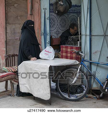 Tailor working in shop, Medina, Marrakesh, Morocco View Large Photo Image Stock Image - Tailor working in shop, Medina, Marrakesh, Morocco. Fotosearch
