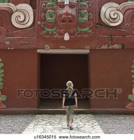 Stock Photography - Teenage girl entering the archaeological museum, Copan, Copan Ruinas, Honduras. Fotosearch
