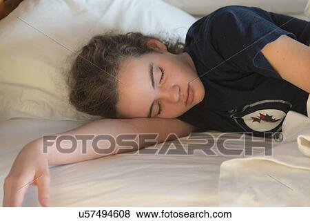 Teenage girl sleeping on the bed, Utila, Bay Islands, Honduras View Large Photo Image Stock Photo - Teenage girl sleeping on the bed, Utila, Bay Islands, Honduras. Fotosearch