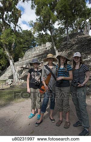 Stock Photo - Tourists at an archaeological site, Copan, Copan Ruinas, Copan Department, Honduras. Fotosearch