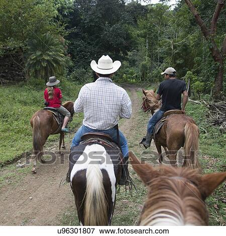 Tourists enjoying horseback riding, Finca El Cisne, Honduras View Large Photo Image Stock Photo - Tourists enjoying horseback riding, Finca El Cisne, Honduras. Fotosearch
