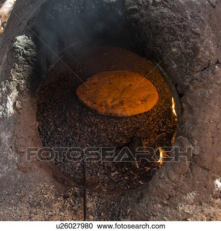 Traditional bread baked on mud oven, Tabounte, Ouarzazate Province, Souss-Massa-Draa, Morocco View Large Photo Image Stock Image - Traditional bread baked on mud oven, Tabounte, Ouarzazate Province, Souss-Massa-Draa, Morocco. Fotosearch