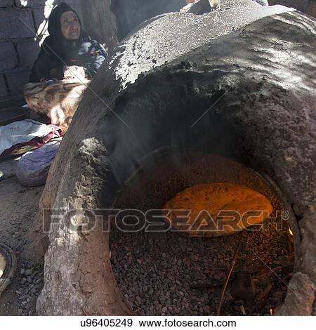 Traditional bread baked on mud oven, Tabounte, Ouarzazate Province, Souss-Massa-Draa, Morocco View Large Photo Image Stock Photo - Traditional bread baked on mud oven, Tabounte, Ouarzazate Province, Souss-Massa-Draa, Morocco. Fotosearch