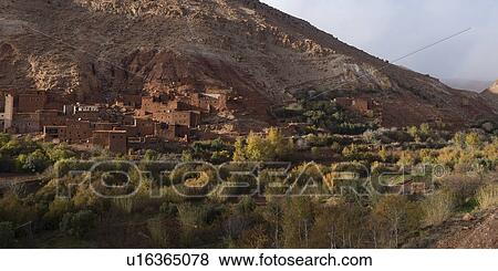 Traditional buildings in town at mountainside, Ouarzazate, Morocco View Large Photo Image Stock Photo - Traditional buildings in town at mountainside, Ouarzazate, Morocco. Fotosearch