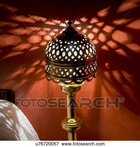 Traditional lamp illuminated in a room at La Sultana Hotel, Marrakesh, Morocco View Large Photo Image Stock Photo - Traditional lamp illuminated in a room at La Sultana Hotel, Marrakesh, Morocco. Fotosearch
