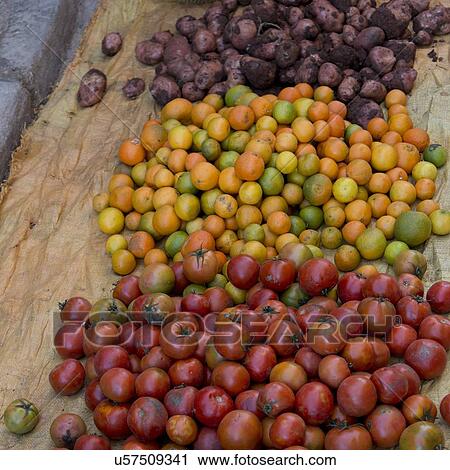 Stock Image - Vegetable for sale at a market stall, Medina, Marrakesh, Morocco. Fotosearch
