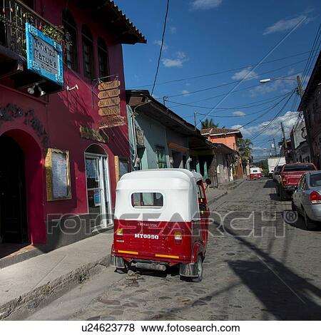 Stock Photo - Vehicles on a street, Copan, Copan Ruinas, Honduras. Fotosearch