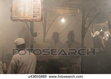 Stock Photo - Vendors at food stall, Djemma El Fna, Marrakesh, Morocco. Fotosearch