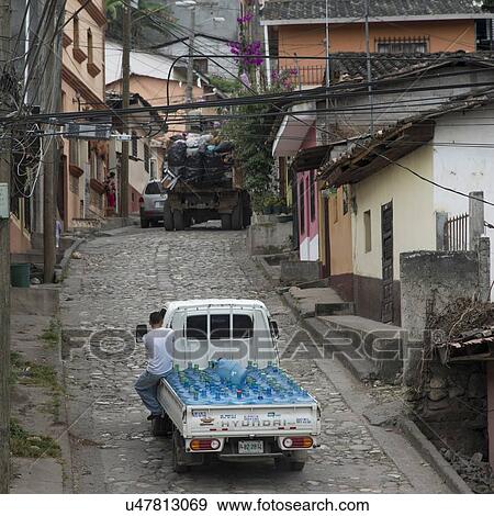 Stock Photo - Water bottles delivery truck on street, Barrio El Centro, Copan, Copan Ruinas, Honduras. Fotosearch