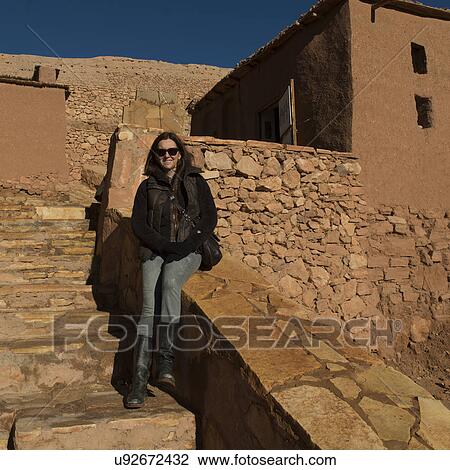 Stock Image - Woman at a fort, Ait Benhaddou, Ouarzazate, Souss-Massa-Draa, Morocco. Fotosearch