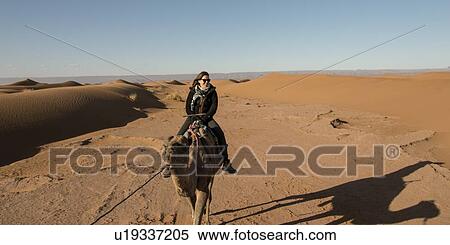 Woman riding a camel in Erg Chegaga Dunes, Sahara Desert, Souss-Massa-Draa, Morocco View Large Photo Image Stock Photography - Woman riding a camel in Erg Chegaga Dunes, Sahara Desert, Souss-Massa-Draa, Morocco. Fotosearch