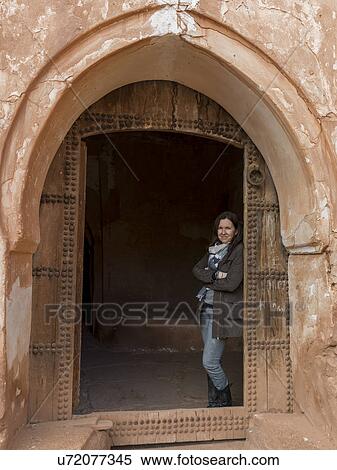 Woman standing at the doorway of Kasbah of Glaoui, Telouet, Ouarzazate, Souss-Massa-Draa, Morocco View Large Photo Image Stock Photography - Woman standing at the doorway of Kasbah of Glaoui, Telouet, Ouarzazate, Souss-Massa-Draa, Morocco. Fotosearch