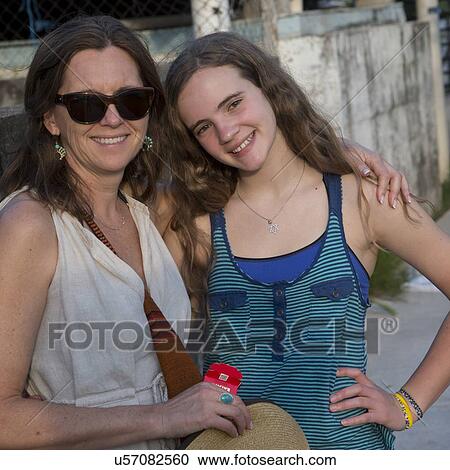Stock Image - Woman with her daughter smiling, Cayman Cay, Utila Island, Bay Islands, Honduras. Fotosearch