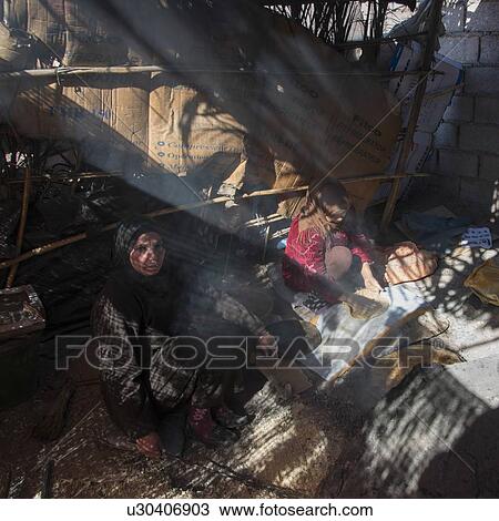 Woman working in her damaged hut, Ouarzazate, Souss-Massa-Draa, Morocco View Large Photo Image Stock Image - Woman working in her damaged hut, Ouarzazate, Souss-Massa-Draa, Morocco. Fotosearch