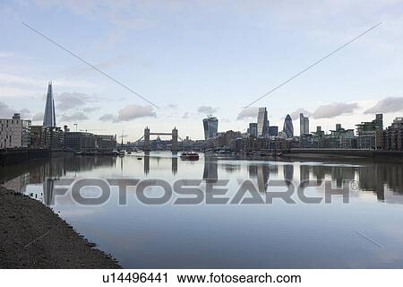 Stock Image - City skyline and River Thames, London, UK. Fotosearch