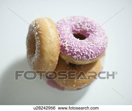Close-up of donuts on counter View Large Photo Image Stock Photograph - Close-up of donuts on counter. Fotosearch