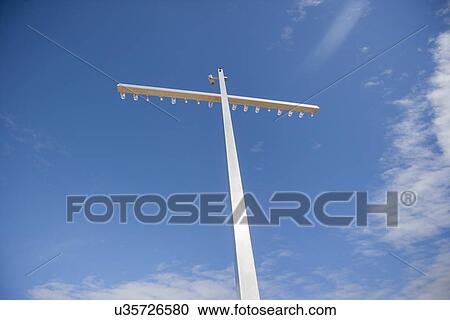 Low angle view of floodlight against sky View Large Photo Image Stock Image - Low angle view of floodlight against sky. Fotosearch