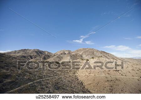 Mountains and blue sky View Large Photo Image Stock Photo - Mountains and blue sky. Fotosearch