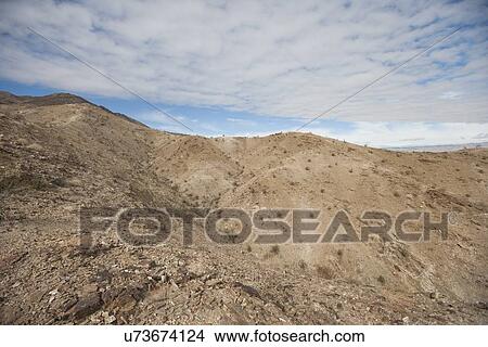 Mountains and cloudy sky View Large Photo Image Picture - Mountains and cloudy sky. Fotosearch
