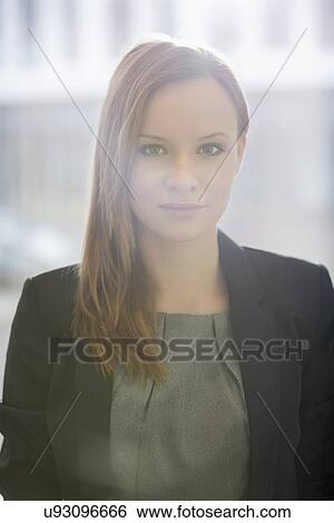 Portrait of confident businesswoman in office View Large Photo Image Stock Photograph - Portrait of confident businesswoman in office. Fotosearch