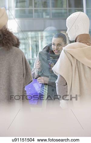 Young woman window shopping View Large Photo Image Picture - Young woman window shopping. Fotosearch