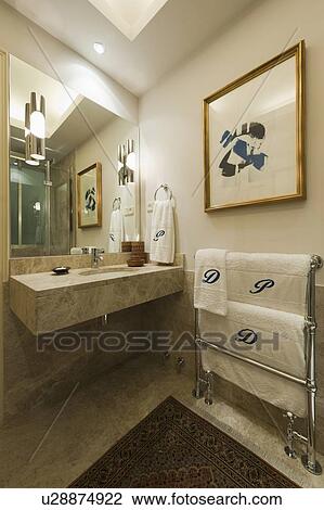 Contemporary Bathroom With Mirror Over Washbasin By Towel Rack And