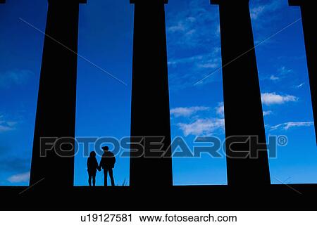 A young couple hold hands on the National Monument of Scotland on Calton Hill in Edinburgh View Large Photo Image Stock Image - A young couple hold hands on the National Monument of Scotland on Calton Hill in Edinburgh. Fotosearch