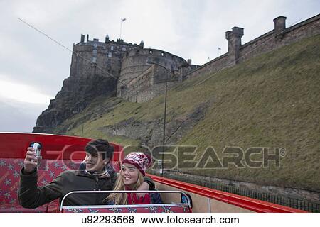 A young couple on an open-top bus tour of Edinburgh Scotland View Large Photo Image Stock Photo - A young couple on an open-top bus tour of Edinburgh Scotland. Fotosearch
