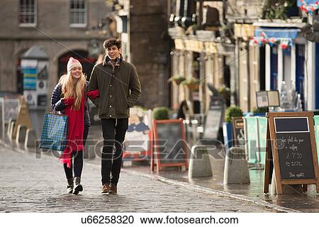 A young couple shop in the Grassmarket in Edinburgh, Scotland View Large Photo Image Stock Image - A young couple shop in the Grassmarket in Edinburgh, Scotland. Fotosearch
