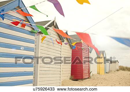Beach huts and bunting, Southwold, Suffolk, UK View Large Photo Image Stock Image - Beach huts and bunting, Southwold, Suffolk, UK. Fotosearch