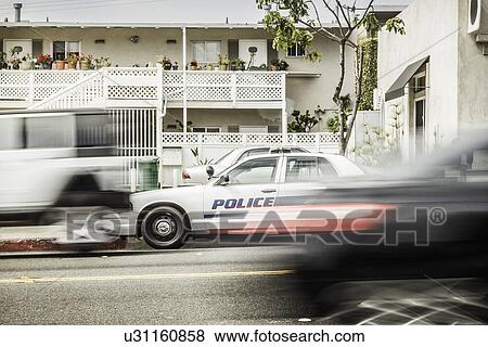 Blurred motion shot of speeding police car View Large Photo Image Stock Photo - Blurred motion shot of speeding police car. Fotosearch