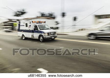Stock Photography - Blurred motion shot of speeding ambulance. Fotosearch