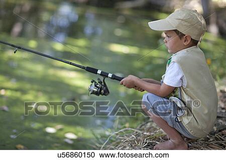 Boy fishing by stream View Large Photo Image Stock Image - Boy fishing by stream. Fotosearch