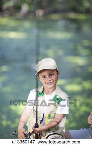 Stock Photo - Boy with fishing rod. Fotosearch