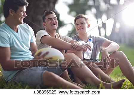 Boys taking break from game View Large Photo Image Stock Photo - Boys taking break from game. Fotosearch