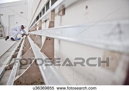 Stock Photography - Builder at work. Fotosearch